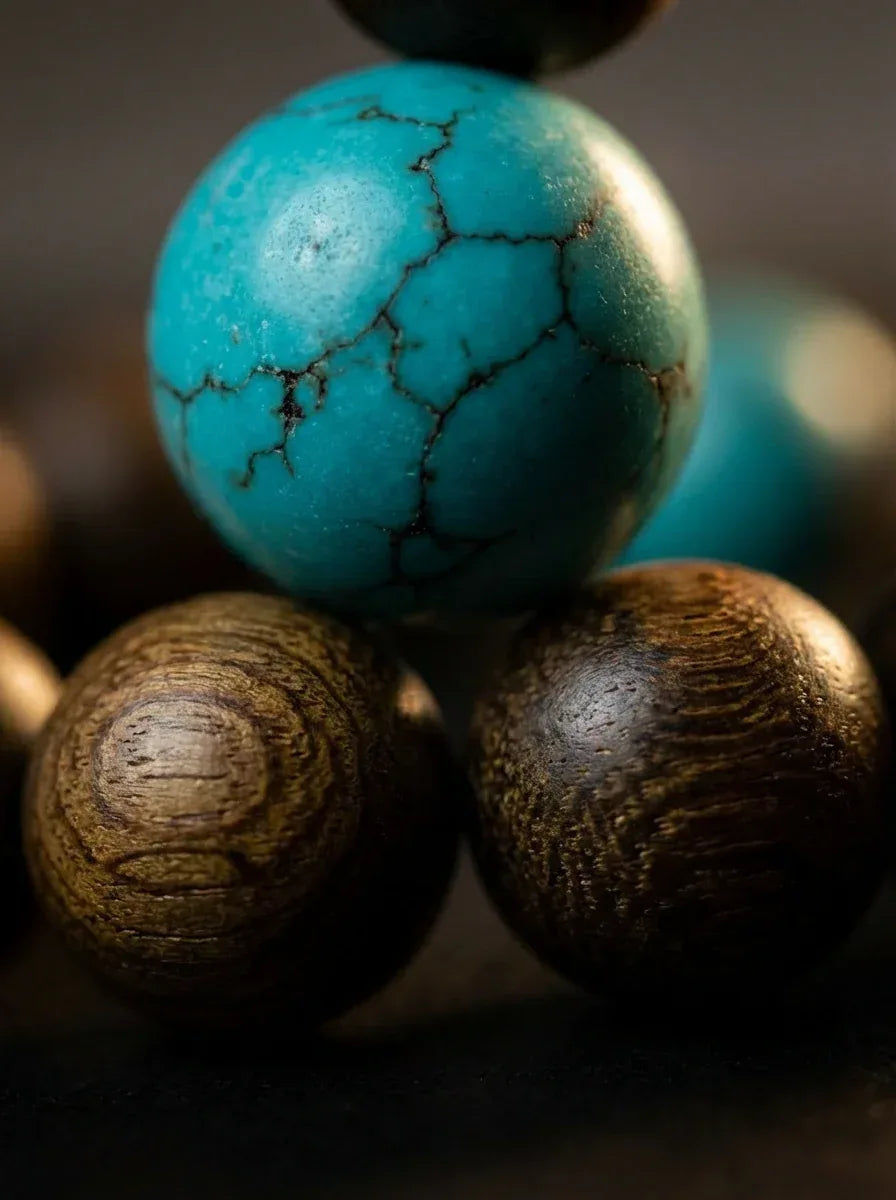 Close-up of Grounded Bracelet, natural green sandalwood and polished turquoise unisex beads. Its timeless design ensures it stays a staple in your jewelry collection for years.