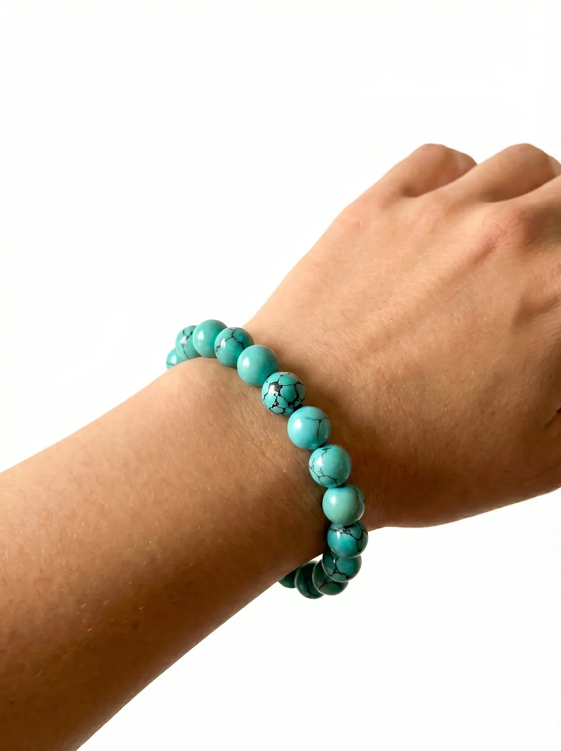 OresGreen Stillness Turquoise Bracelet worn on wrist, sleek natural turquoise bracelet with minimalist design. Its timeless design ensures it stays a staple in your jewelry collection for years.