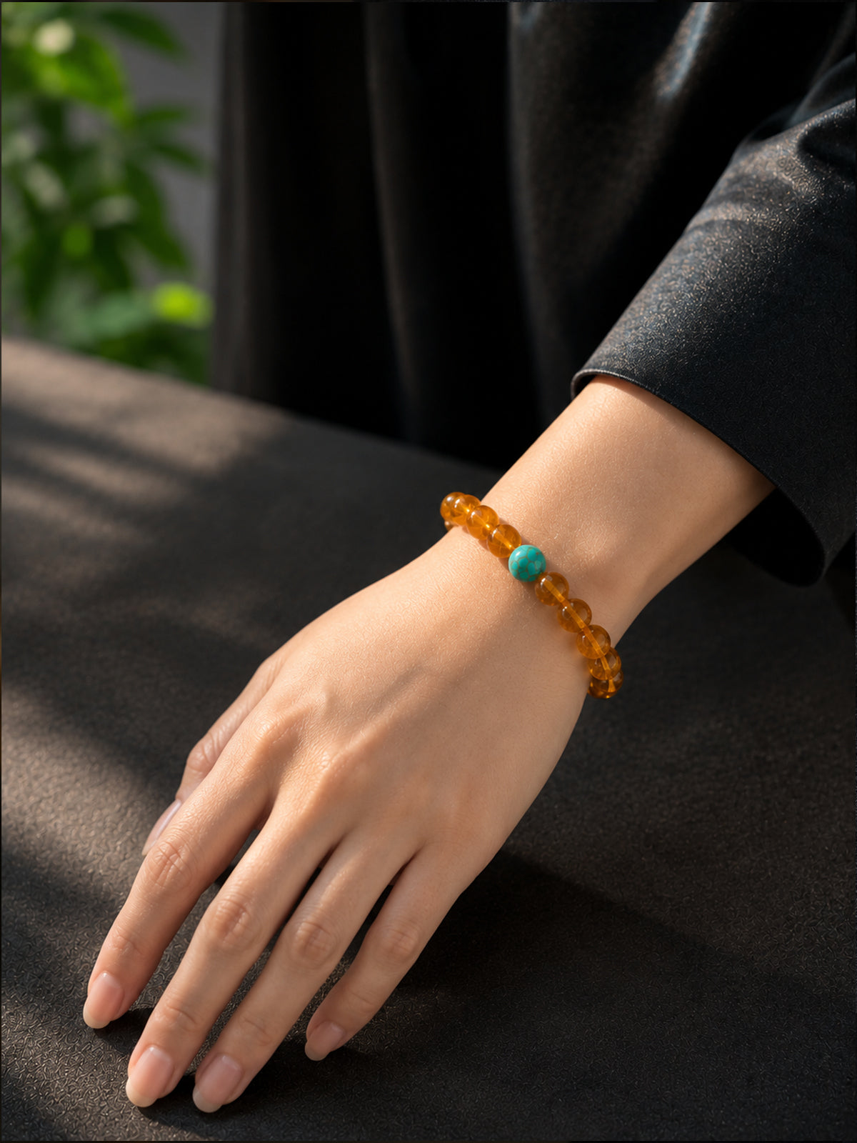 Minimalist everyday luxury style demonstration featuring the Amber Glow Bracelet worn comfortably on a hand.