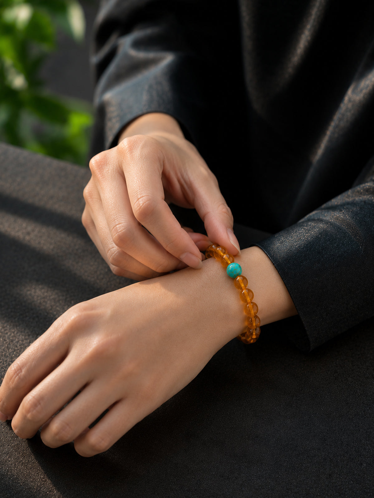 Detailed view of the OresGreen Amber Glow Bracelet being worn, highlighting its lightweight and delicate aesthetic.